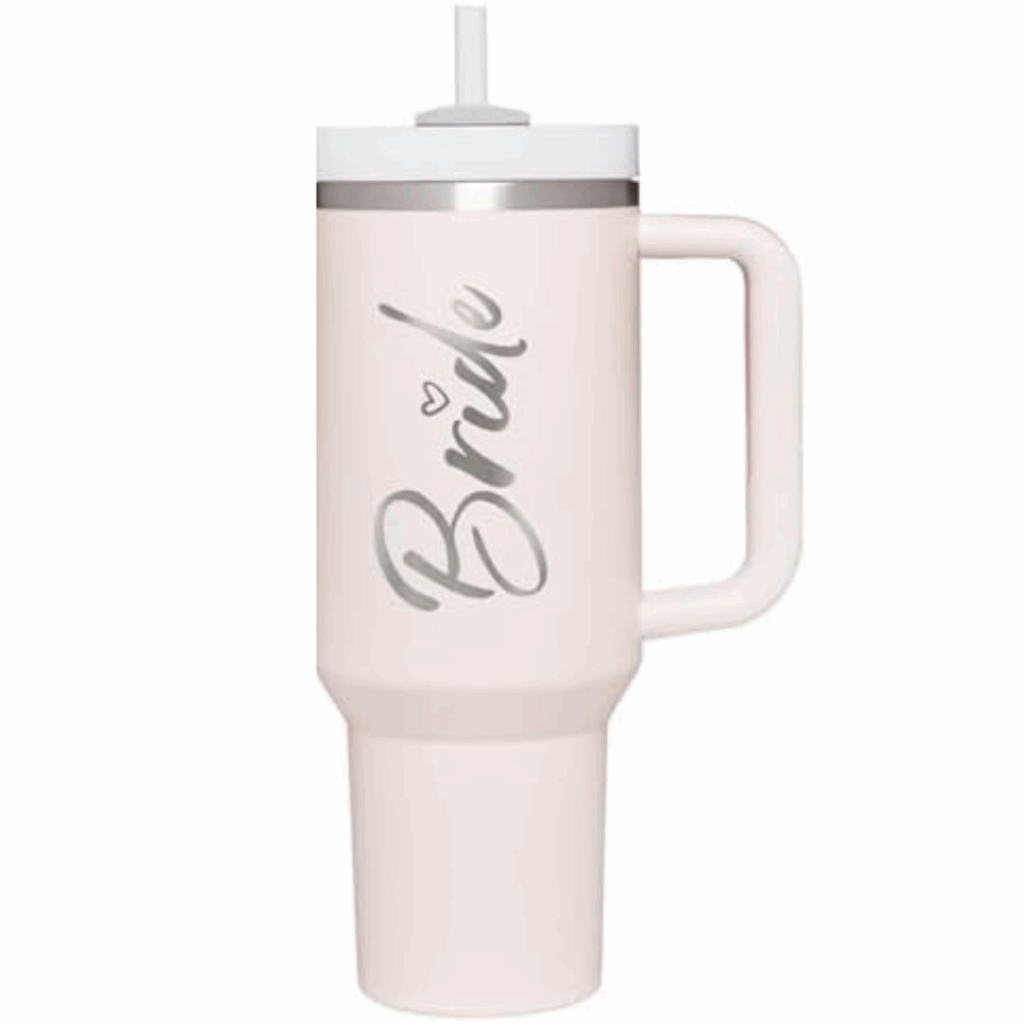 Blush-pink insulated tumbler with handle and straw labeled “Bride” — perfect for wedding-morning hydration.