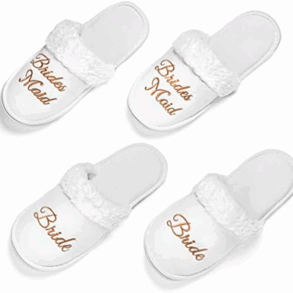 White fluffy “Bride” and “Bridesmaid” slippers—cozy bridal footwear for a wedding day emergency kit essential