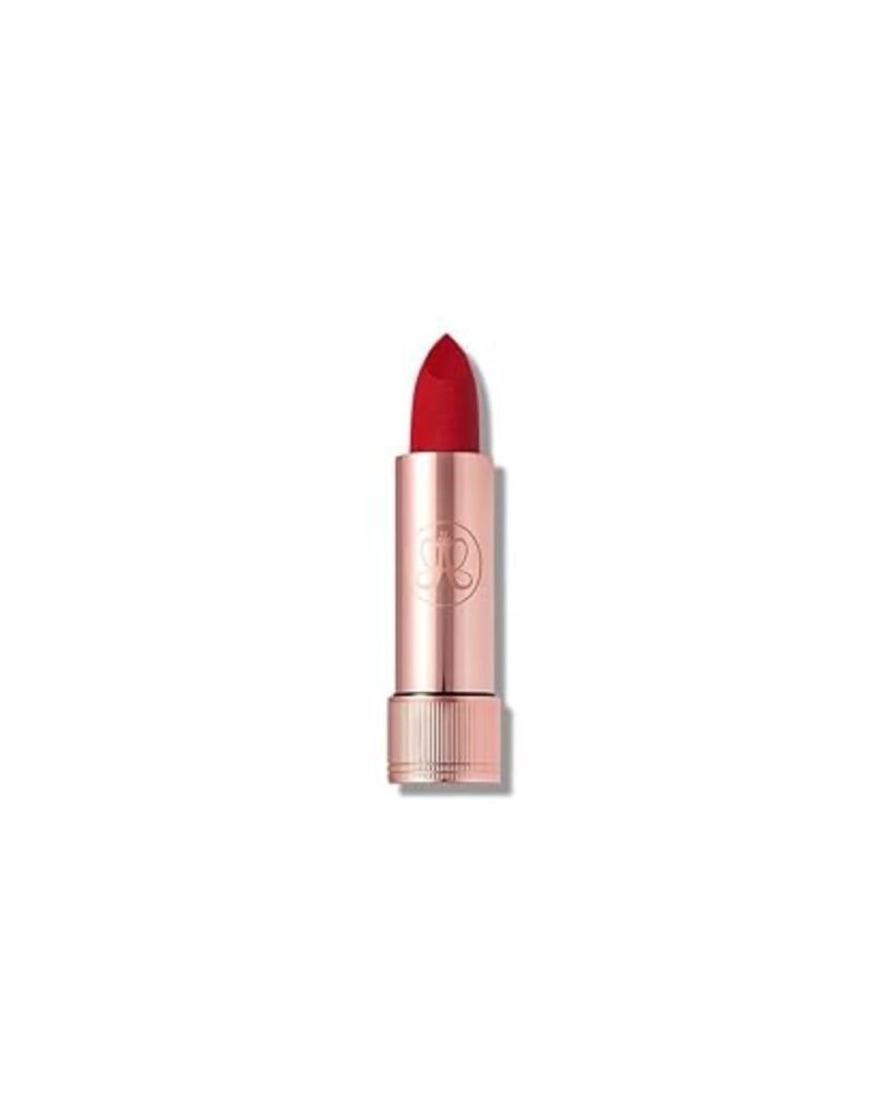 Rose-gold lipstick tube with a vibrant red matte bullet extended
