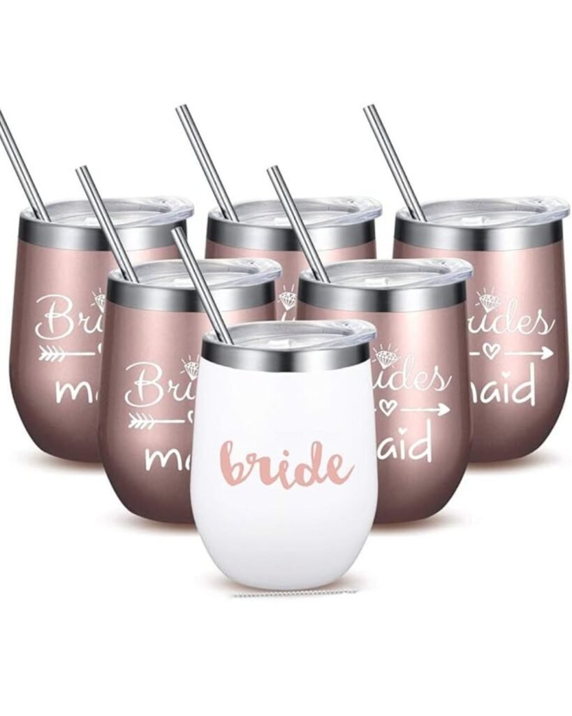 A set of insulated stainless steel stemless wine tumblers: one white tumbler printed “bride” in rose-gold script and five rose-gold tumblers printed “bridesmaid” with arrow accents, each featuring a clear spill-proof lid and metal straw.