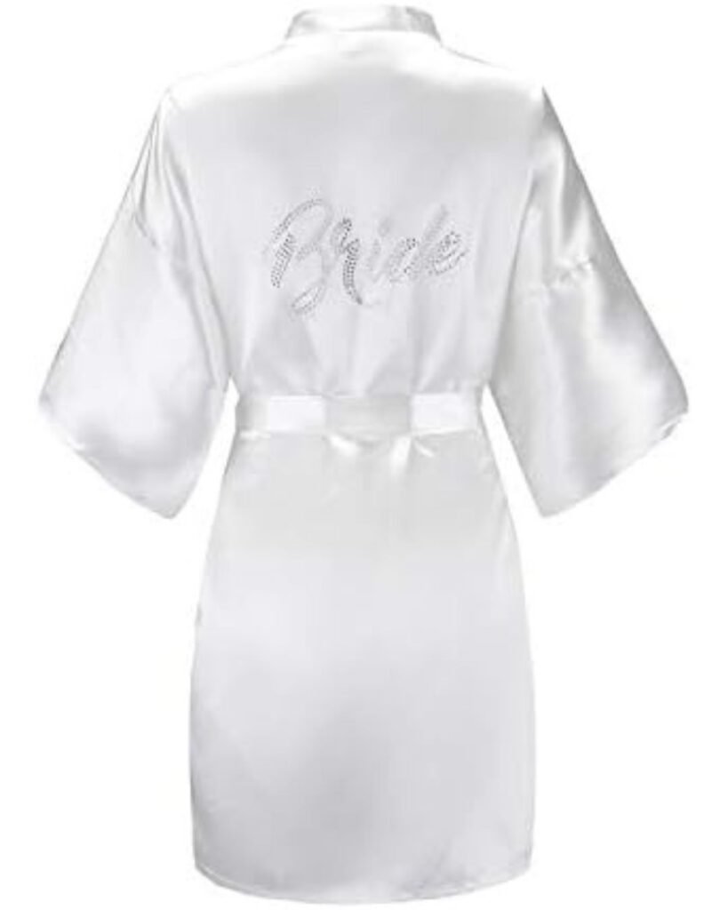 White satin bride robe with rhinestone "Bride" text on the back, perfect for wedding hair & makeup prep