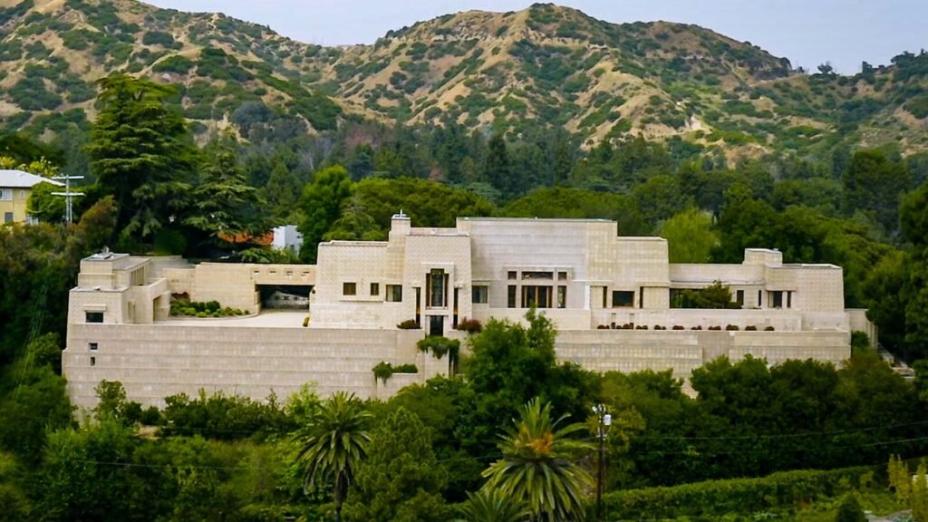 Ennis House LA aerial view—Frank Lloyd Wright’s Mayan-inspired landmark surrounded by Los Feliz hills and palm trees