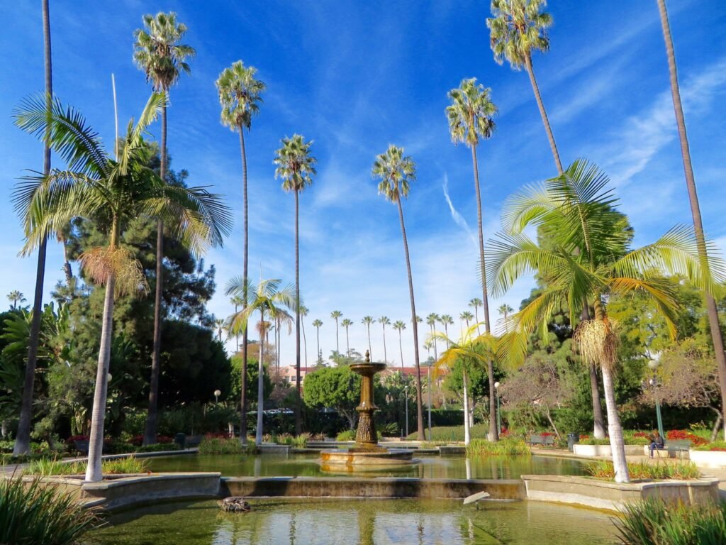 Will Rogers Beverly Hills reflecting pond and fountain surrounded by tall palm trees