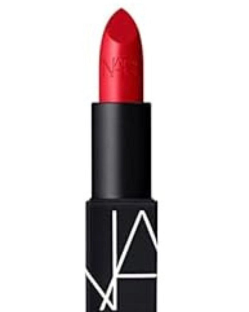 Bold red lipstick to own the night in a sleek black tube against a white background.