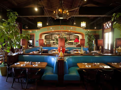 Interior of The Luggage Room Pasadena with turquoise booths and vintage decor