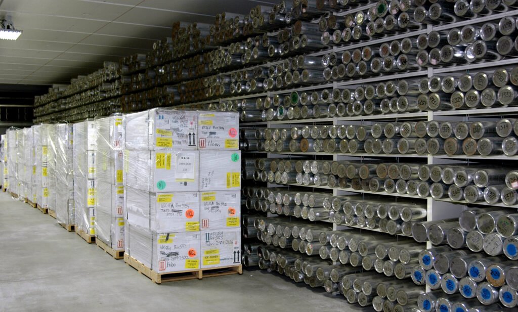 Pallets of labeled boxes and shelves of ice core samples at the National Ice Core Lab in Denver, Colorado.