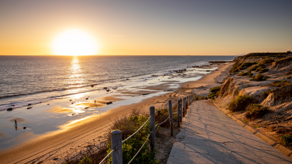 Sunset view from Crystal Cove State Park beach in Orange County — one of the best things to do in Orange County weekend.