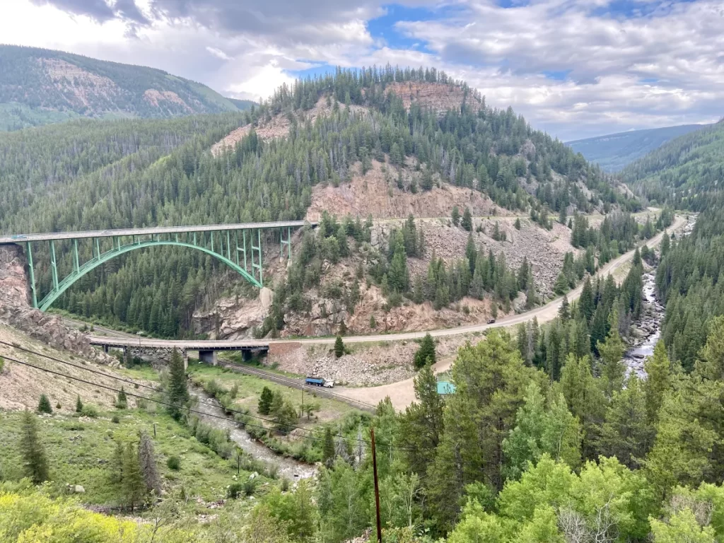 Scenic view of the Tennessee Pass bridge and mountain valley near Leadville, Colorado.