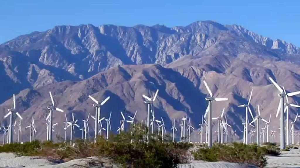 Scenic view of Palm Springs windmills with desert mountains in the background