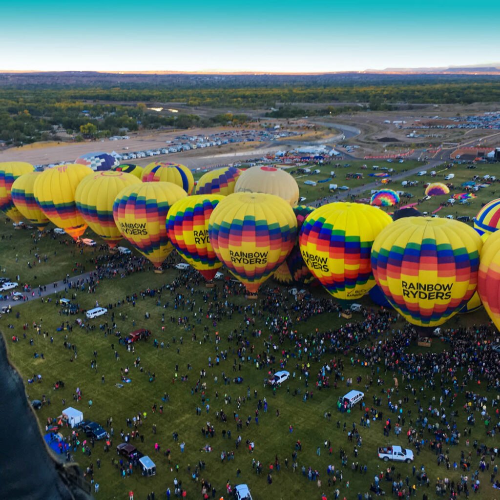 Rainbow Ryders hot air balloons preparing for flight at sunrise in Phoenix, Arizona.