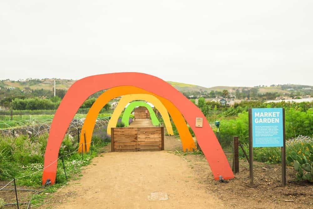 Colorful rainbow arches leading into the Market Garden at The Ecology Center in San Juan Capistrano.