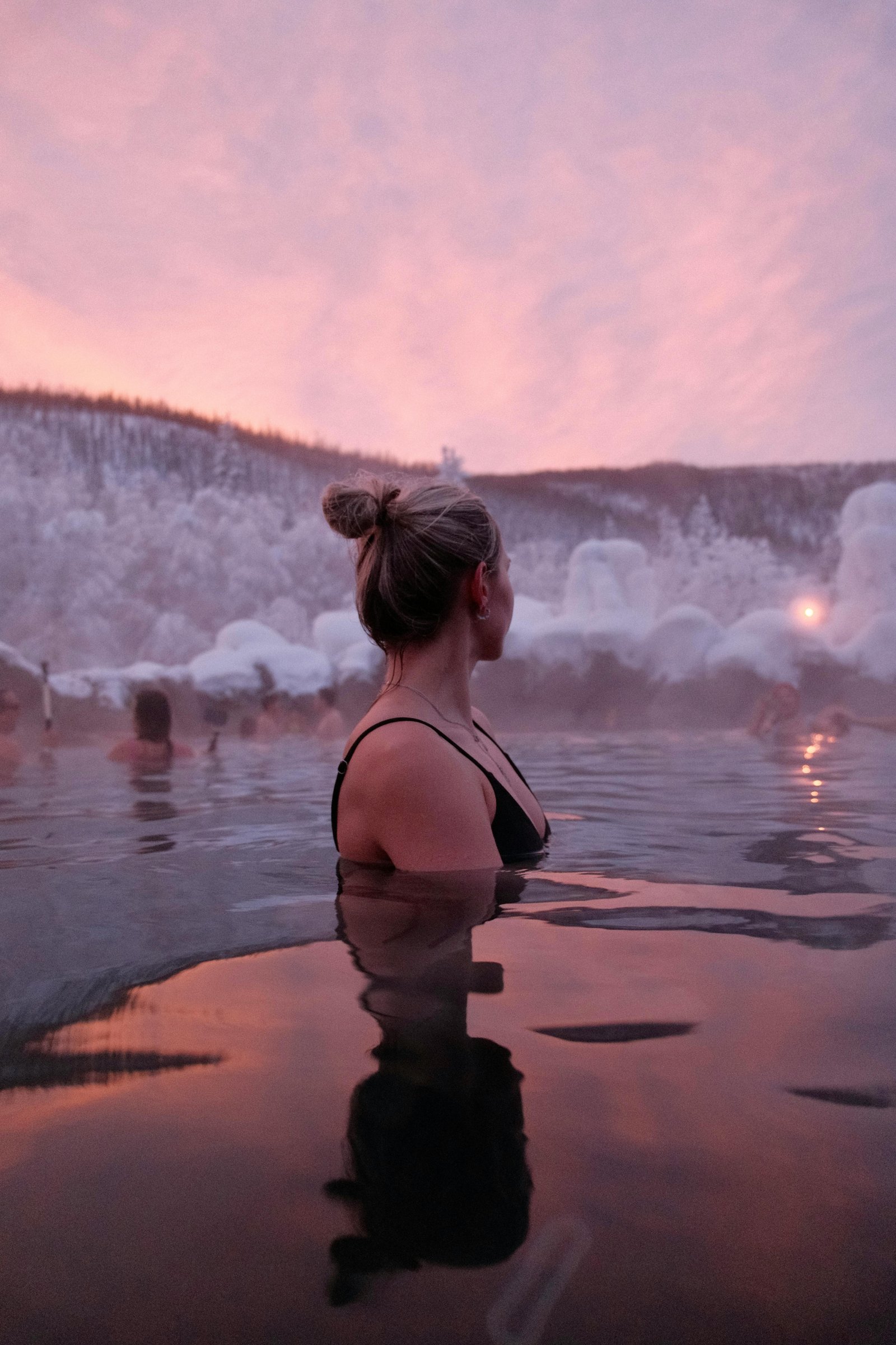Woman enjoying Colorado wellness escapes in a mountain hot spring at sunset.
Woman enjoying Colorado wellness escapes in a mountain hot spring at sunset.