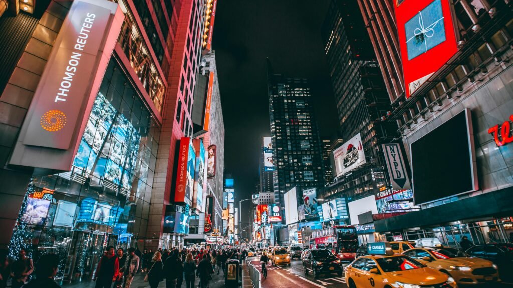 Evening walking tours in NYC with bright Times Square lights and busy streets at night