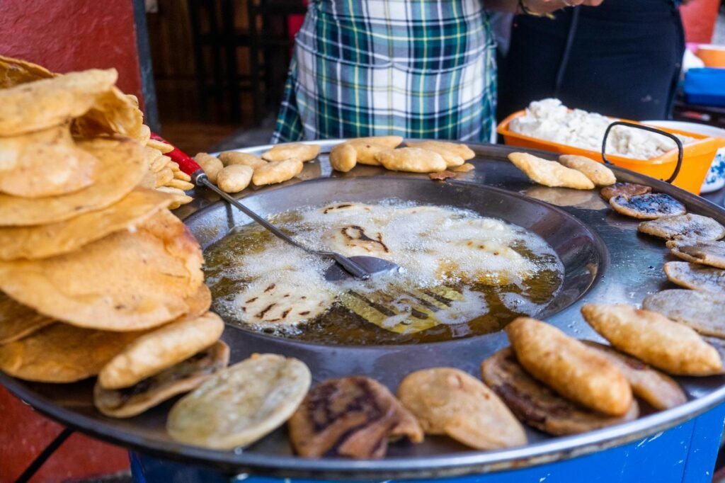 close up of frying flatbread in big pan