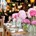 table with plates and flowers filed neatly selective focus photography