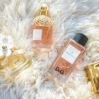 four assorted perfume glass bottles