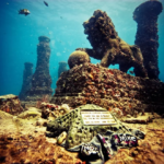 Lion statue and memorial plaque at Neptune Memorial Reef in Key Biscayne, Florida