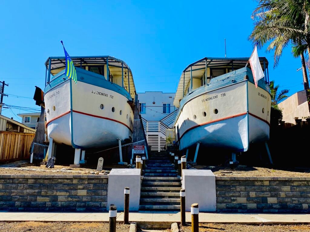 Frontal view of the Encinitas Boat Houses, twin ship-shaped homes SS Encinitas and SS Moonlight, a quirky landmark in Encinitas, California.