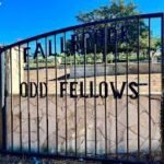 Wrought-iron gate reading ‘Fallbrook Odd Fellows’ at the historic cemetery entrance
