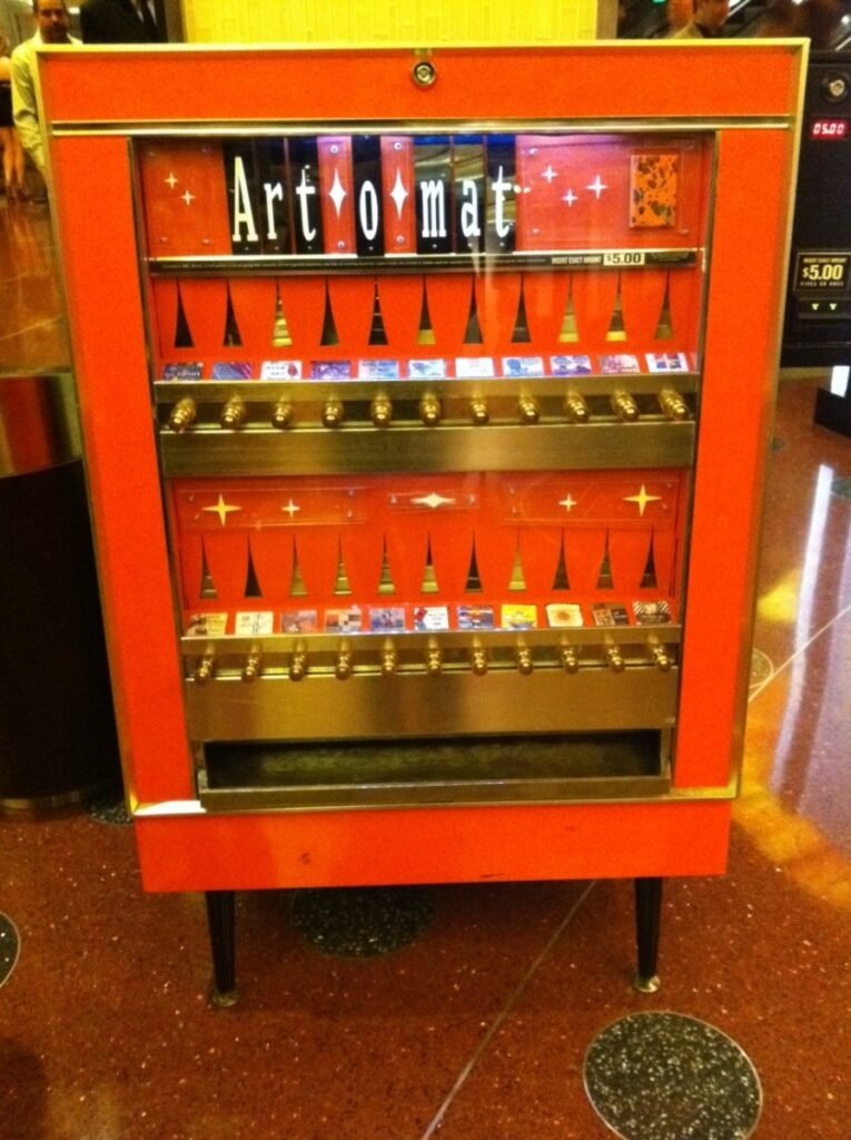 Artomat Vegas vending machine inside the Cosmopolitan Hotel—vintage red cabinet selling pocket-size art for five dollars