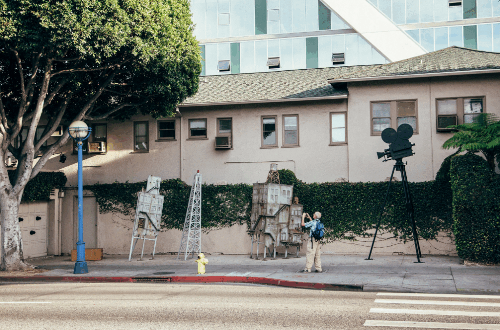 Back Lot West Hollywood exterior with film-inspired sculptures and historic garage wall