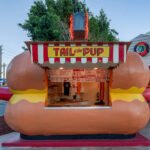Front view of Tail O’ the Pup’s iconic hot-dog-shaped facade and open service window