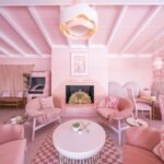 Blush-toned lobby lounge with vintage furniture at Trixie Motel Palm Springs