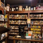 Apothecary shelves of medicine bottles at Ruddy's General Store Museum Palm Springs, complete with Rx mortar