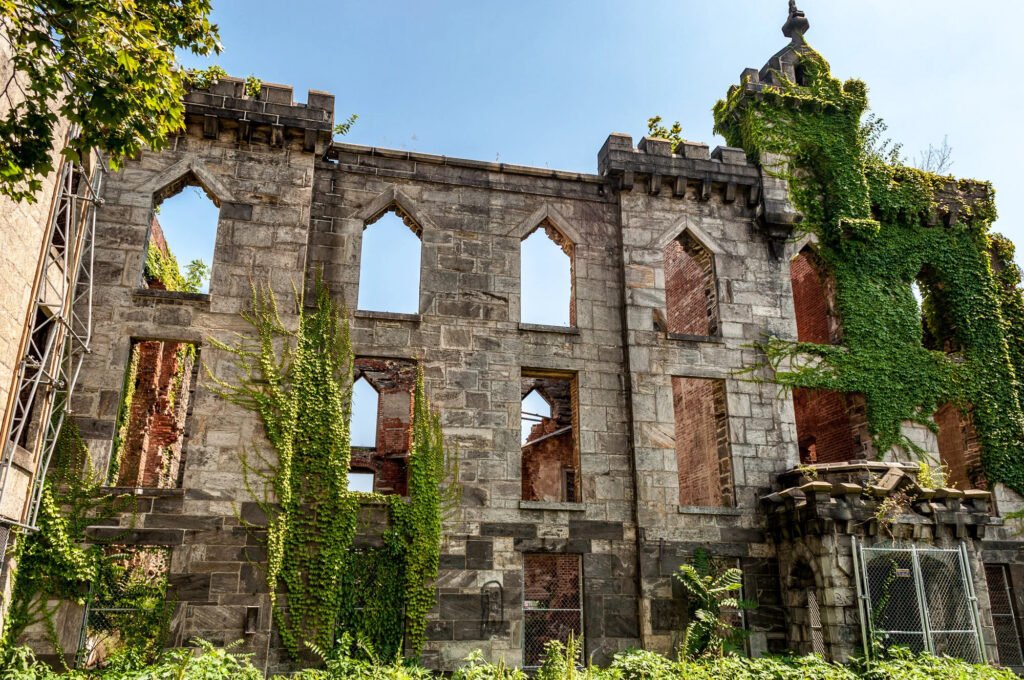 Roosevelt Island Smallpox Ruins covered in ivy with Gothic stone walls in New York City.