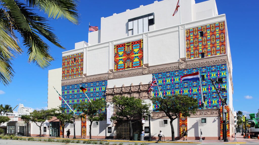 Street view of The Wolfsonian-FIU in Miami Beach, showcasing its vibrant patterned murals and historic building design.
