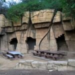 Old Zoo Los Angeles picnic area with stone enclosures and picnic tables in Griffith Park