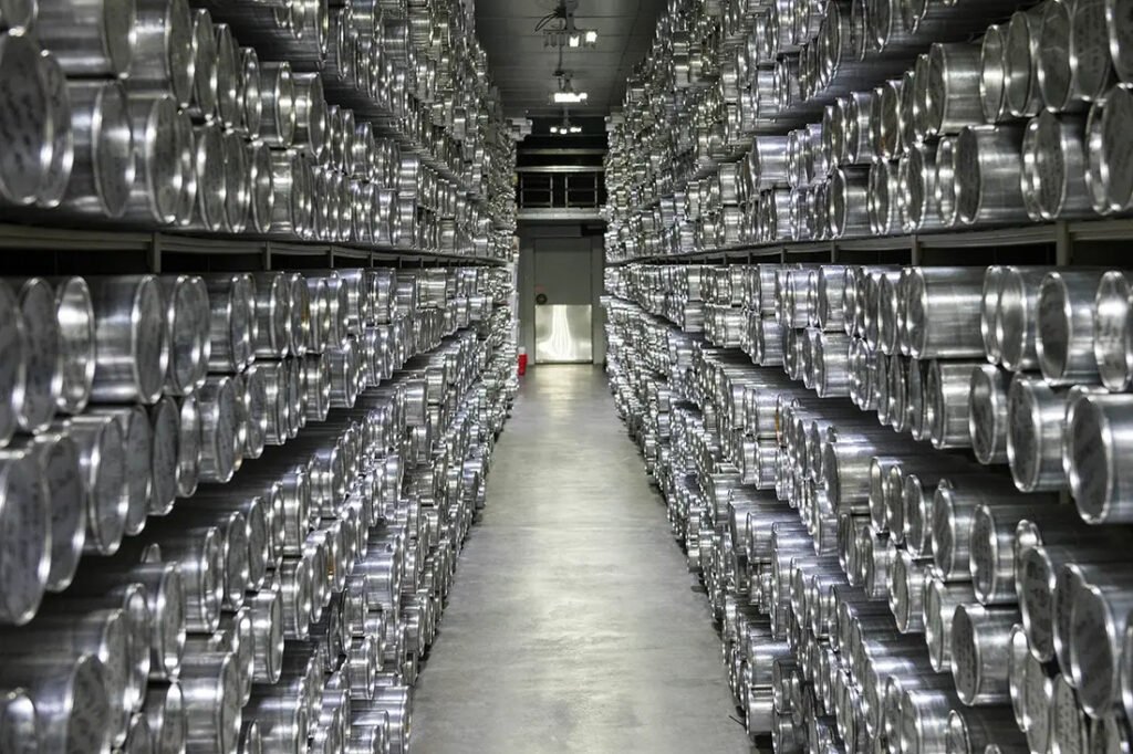 Rows of preserved ice cores stored in metal tubes at the National Ice Core Lab in Denver, Colorado.