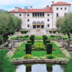 The gardens of Vizcaya Museum Miami featuring manicured hedges, fountains, and historic villa