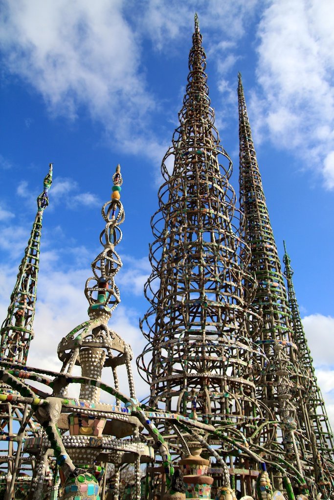 Tall spires of the Watts Towers in Los Angeles reaching into the sky