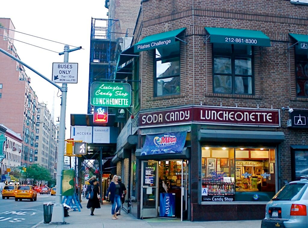 Exterior of Lexington Candy Shop New York with neon luncheonette sign and street view