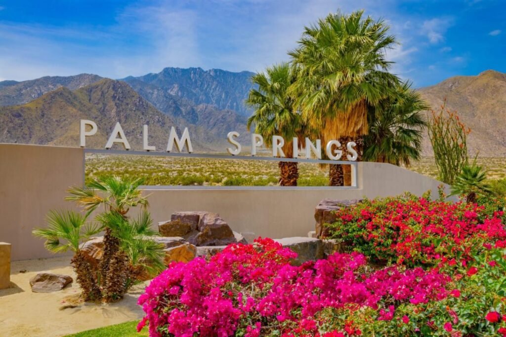 Outdoor café setup under green umbrellas in Palm Springs