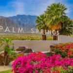 Outdoor café setup under green umbrellas in Palm Springs